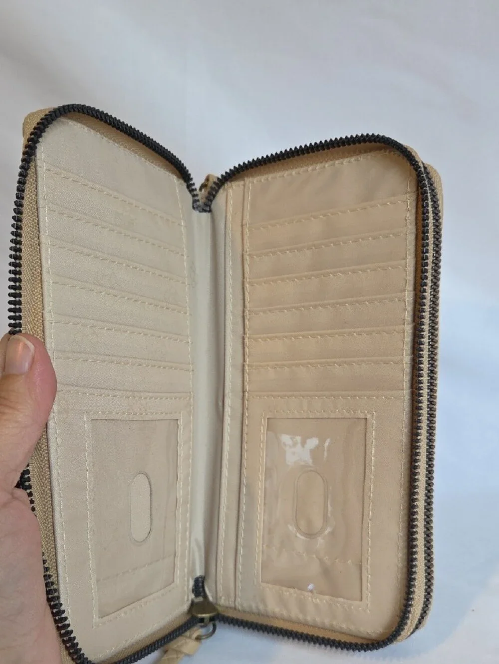 Safe Keeper Beige Textured Woven Zip Around Wristlet Wallet.